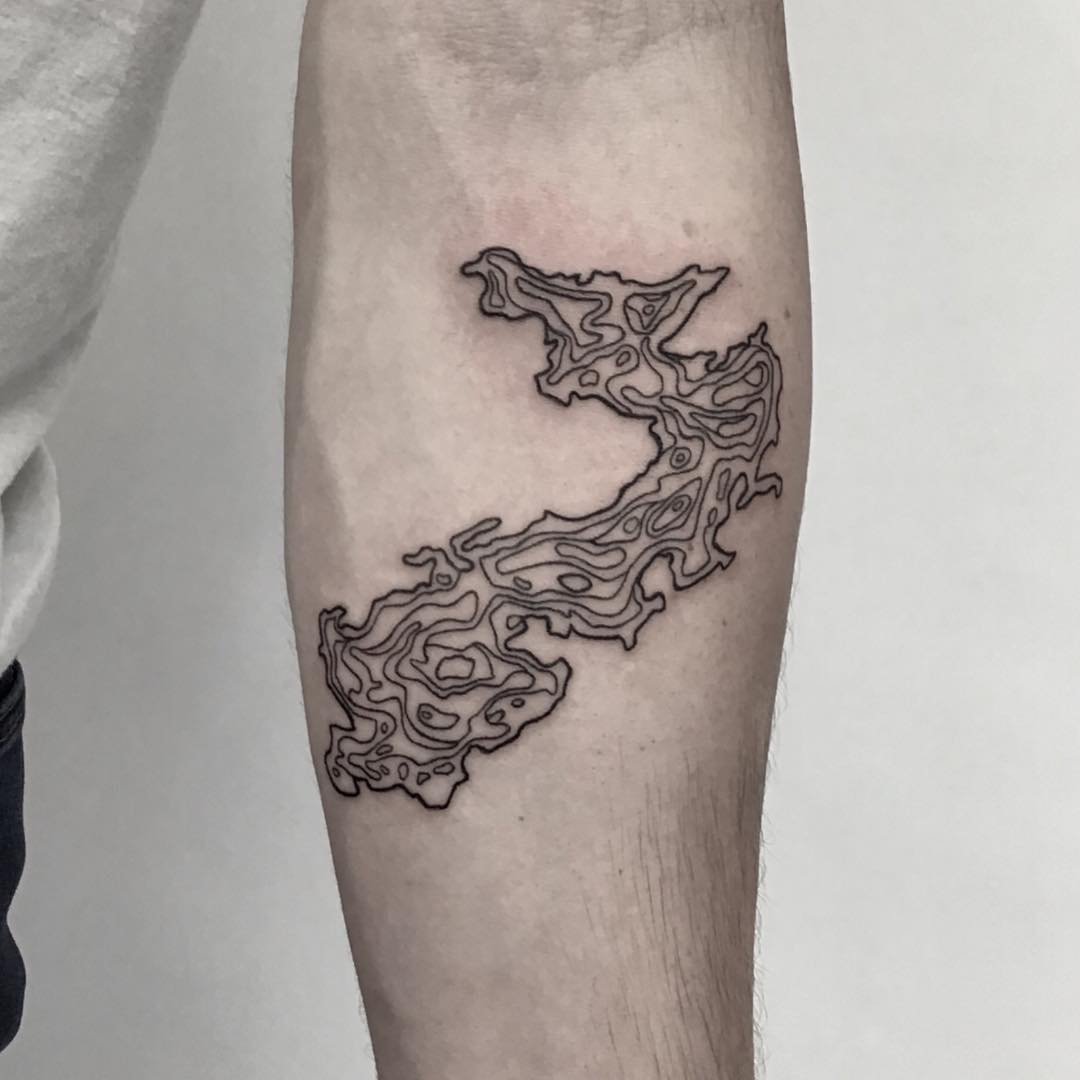 Topographical map of a lake tattoo by Kevin Jenkins
