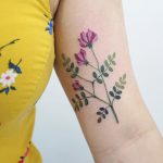 Vicia flower tattoo by tattooist picsola
