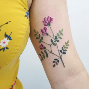 Vicia flower tattoo by tattooist picsola