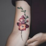 Watercolor flower tattoo by Rey Jasper