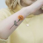 Yellow Marigold tattoo by tattooist picsola