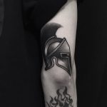 A black helmet tattoo by tattooist yeontaan