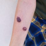Acorn and pine cone by tattooist Nemo