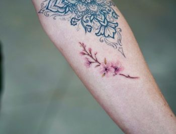 Cherry blossom branch tattoo by Dragon Ink