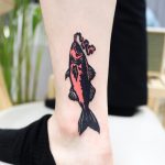 Cover-up fish tattoo by Puff Channel