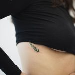 Dainty fern tattoo by Rey Jasper