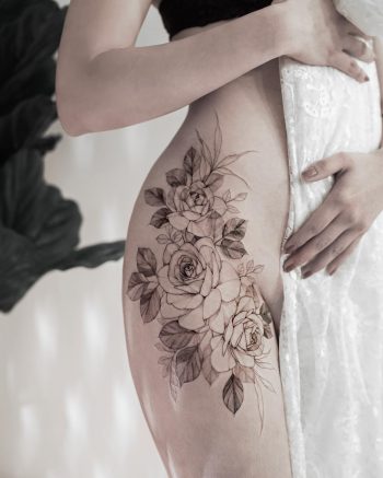 Floral hip piece by tattooist Goyo