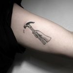 Hammer and nail by tattooist Oozy