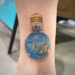 Light bulb with a sea inside by tattooist G.NO