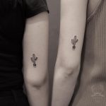 Matching cacti tattoos by Nudy tattooer