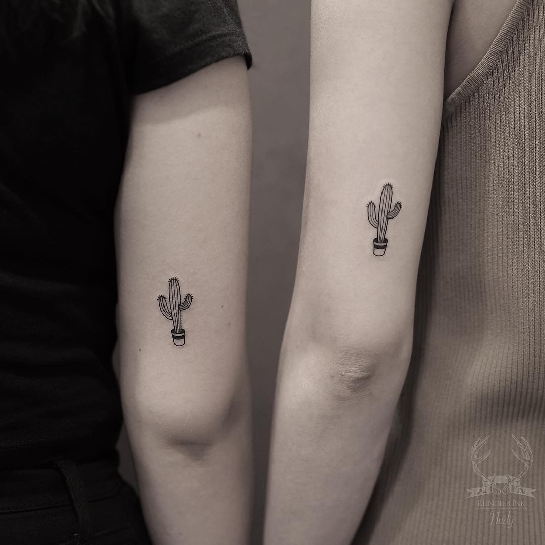 Matching cacti tattoos by Nudy tattooer