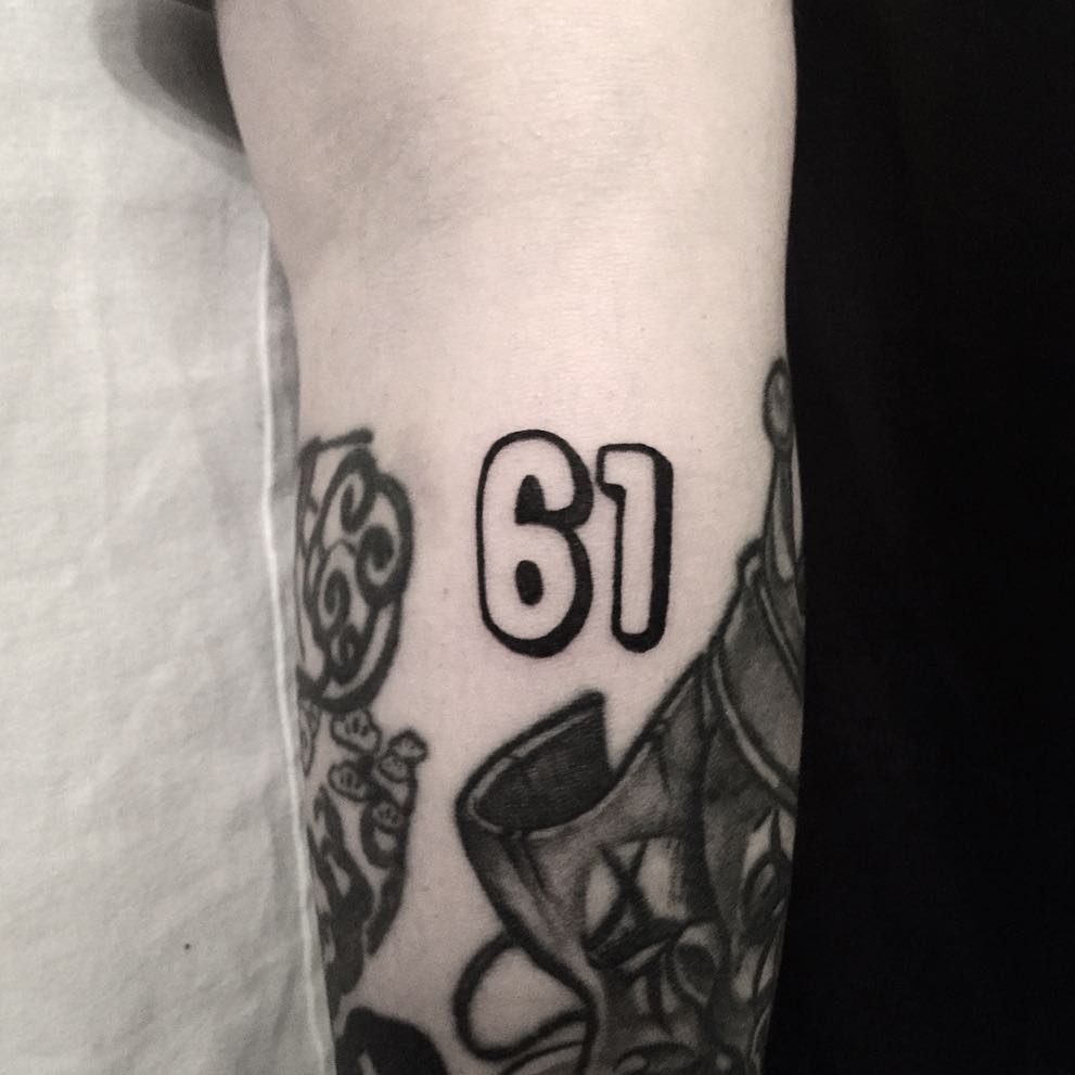 Number 61 tattoo by tattooist yeontaan