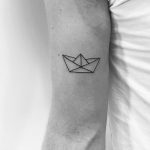 Origami boat tattoo by Philipp Eid
