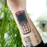 Phone cover-up tattoo by Puff Channel