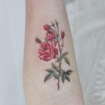 Red flower tattoo by tattooist Nemo