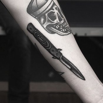 Sharp knife tattoo by Krzysztof Szeszko