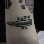 Sleeping pill tattoo by Krzysztof Szeszko