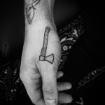 Small ax tattoo by Philipp Eid
