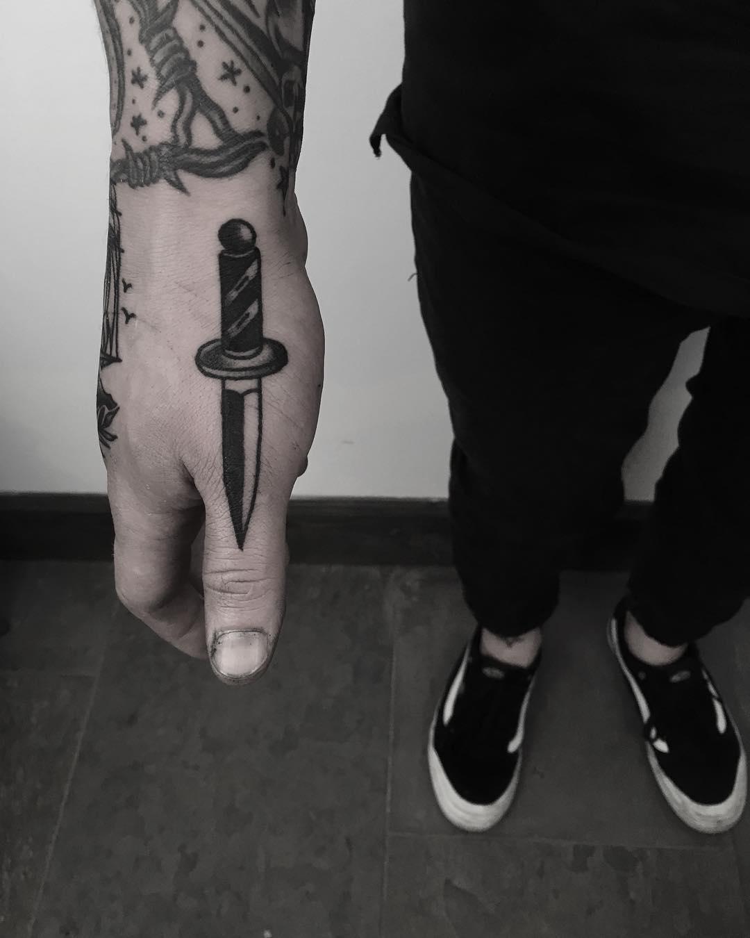 Small knife tattoo by Krzysztof Szeszko