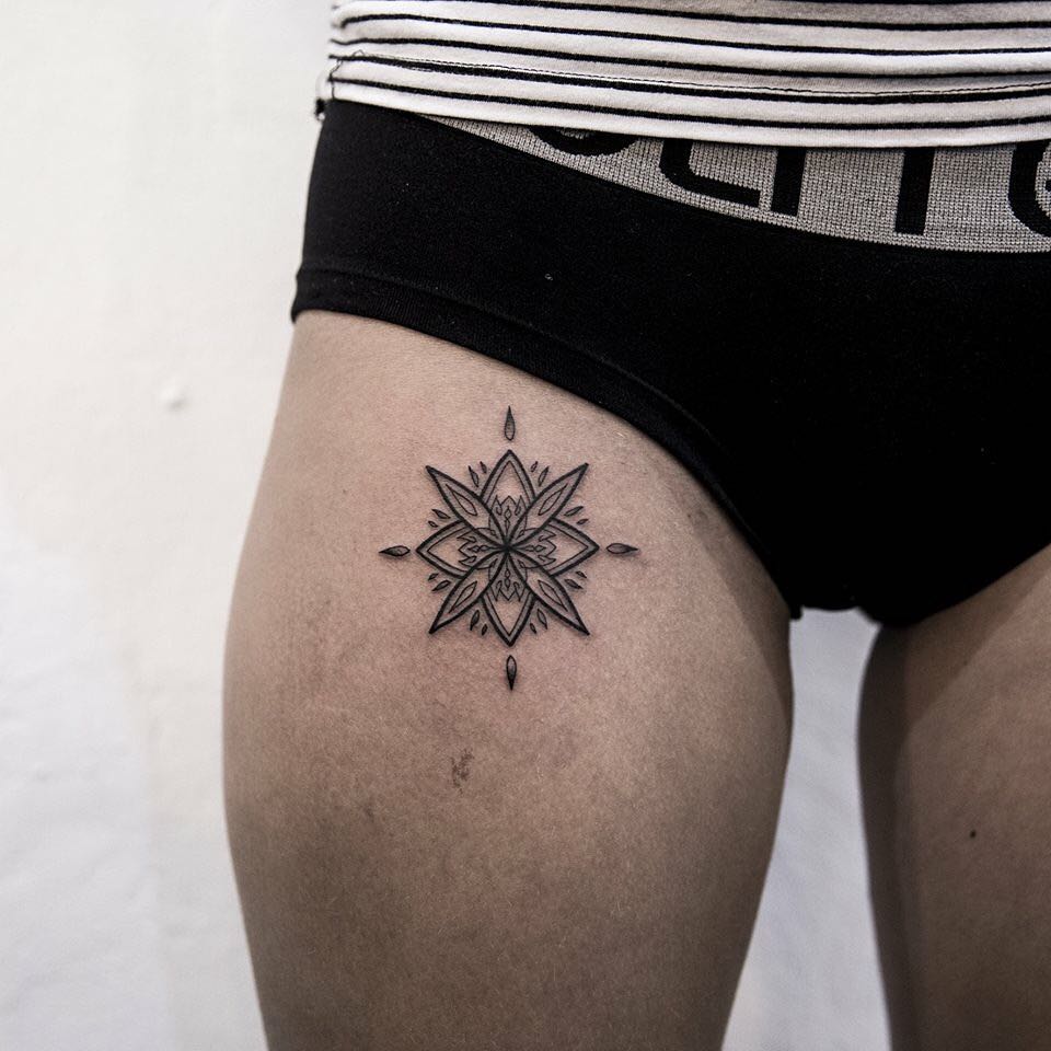 Small mandala on a thigh by Remy B