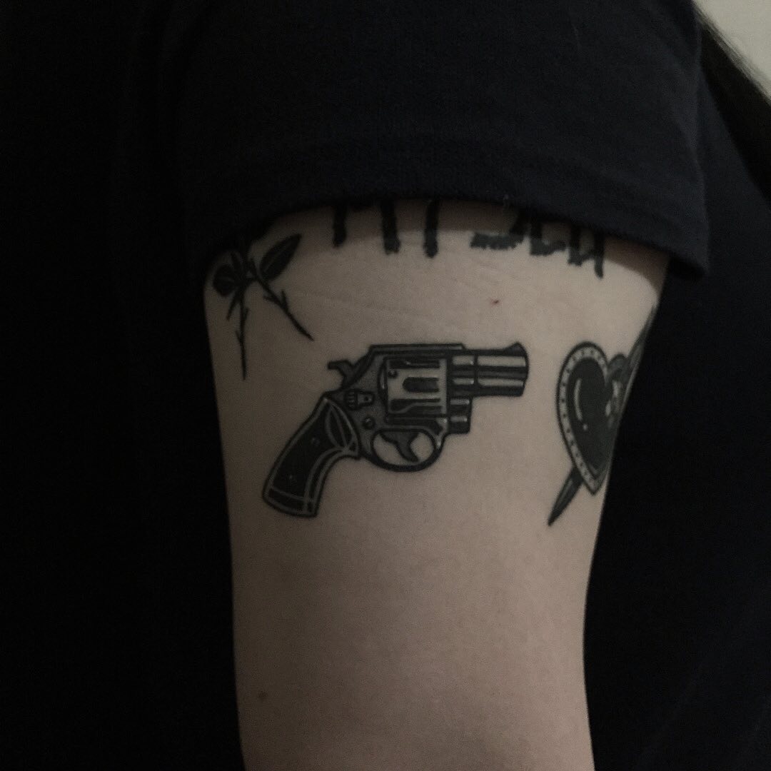 Small revolver by tattooist yeontaan