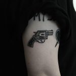 Small revolver tattoo by tattooist yeontaan
