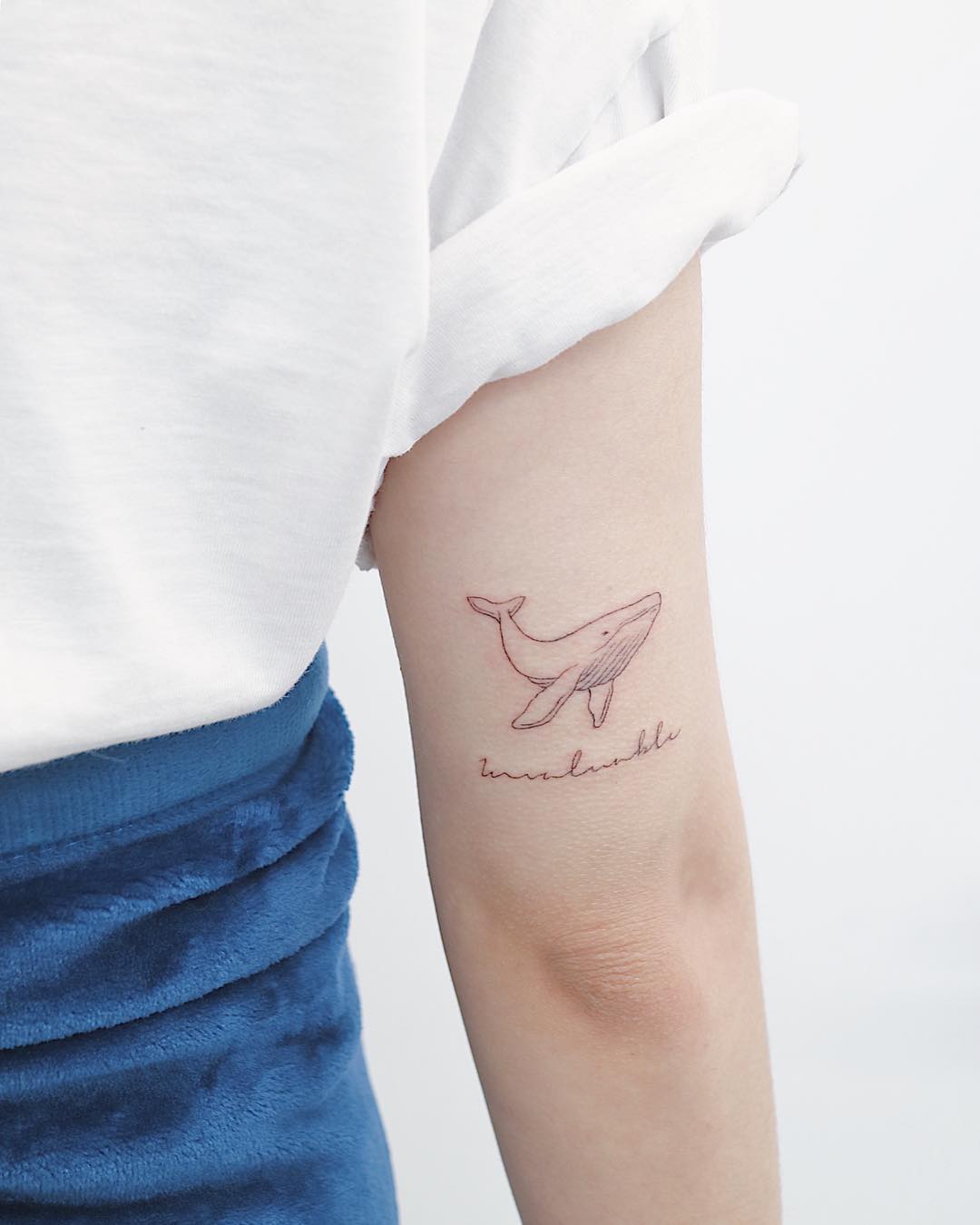 Small whale by tattooist Nemo