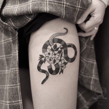 Snake and flowers by Nudy tattooer