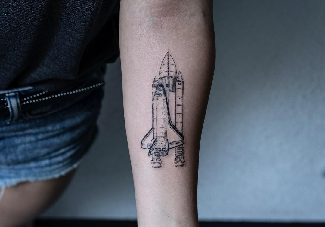 Space shuttle tattoo by tattooist Oozy
