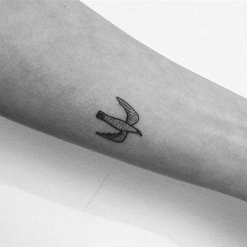 Tiny dove tattoo by Philipp Eid