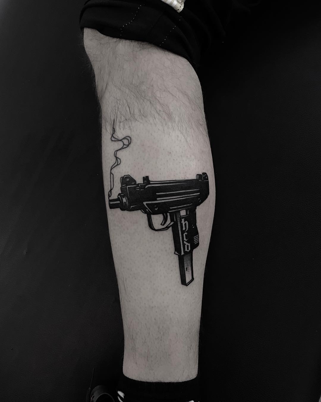 Uzi tattoo by Krzysztof Szeszko