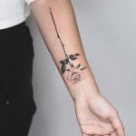 A long rose tattoo by Rey Jasper