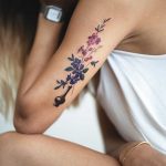 Beautiful flowers inked on the arm by Rey Jasper