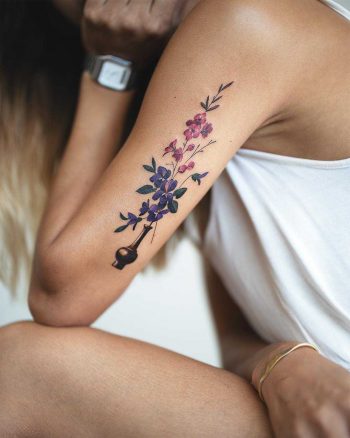 Beautiful flowers inked on the arm by Rey Jasper