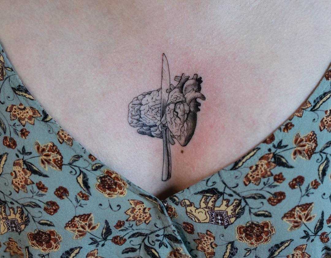 Brain, heart, and knife by tattooist Oozy
