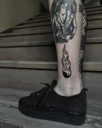Burning Yin Yang tattoo by Krzysztof Szeszko