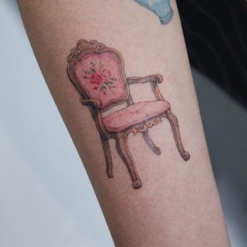 Comfortable vintage chair tattoo by Mumi Ink