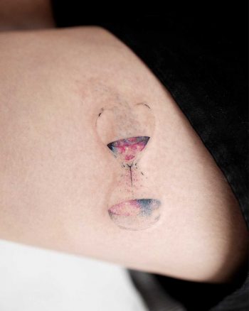 Cosmic hourglass tattoo by Studio Bysol