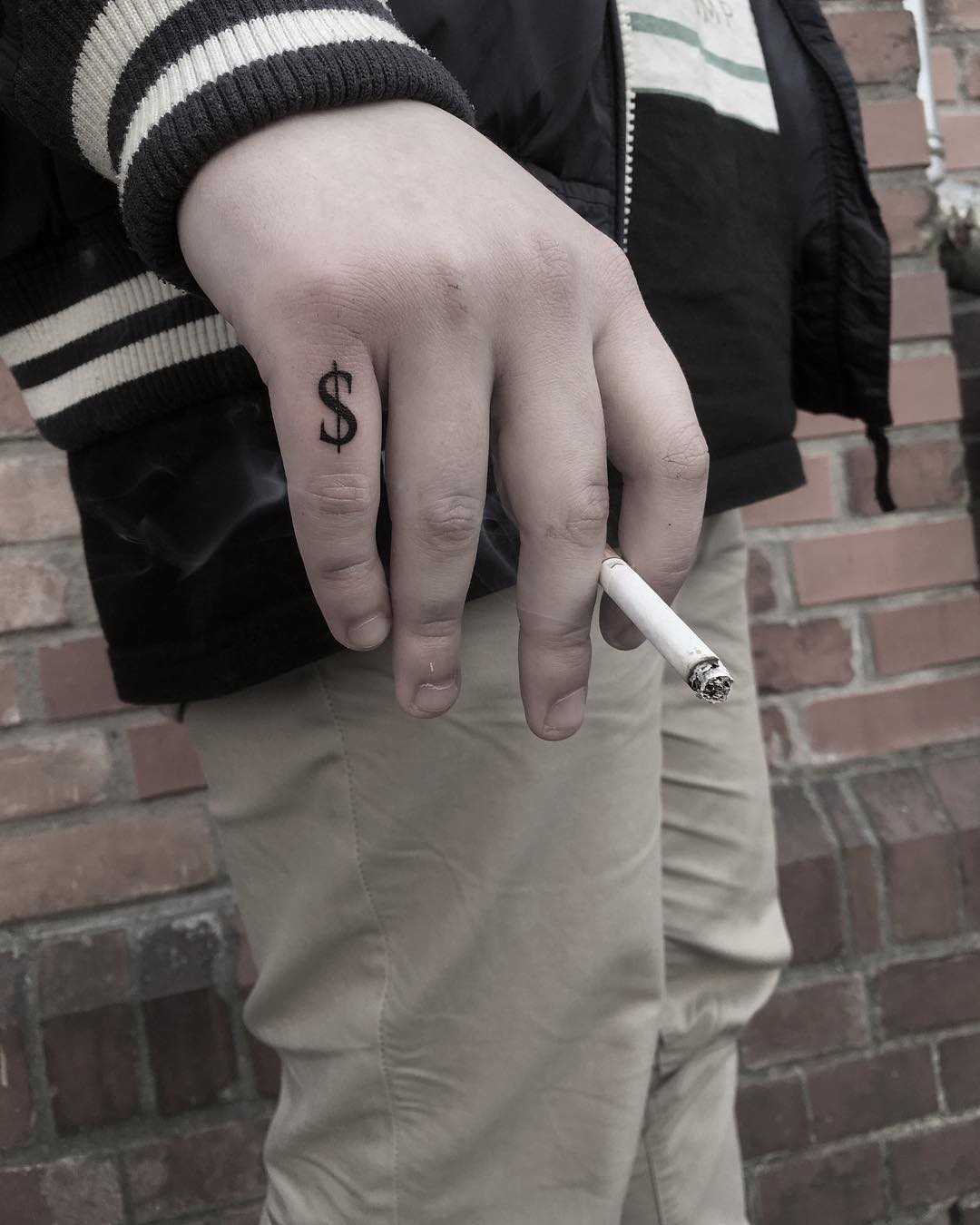 Dollar symbol $ tattoo by Krzysztof Szeszko