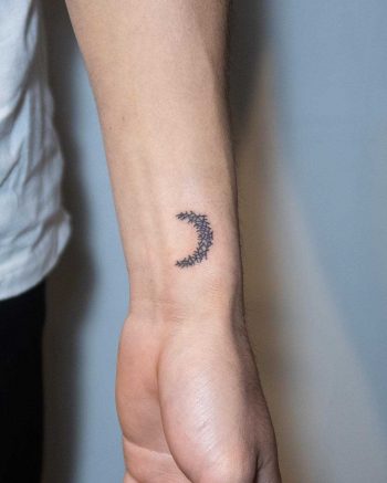 Hand-poked moon by tattooist Bongkee