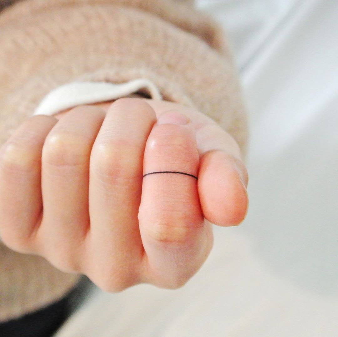 Hand-poked ring by tattooist Cozy