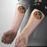 Klimt's matching tattoos by Rey Jasper