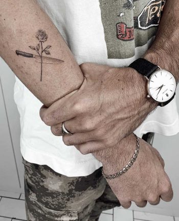 Knife and flower tattoo by Mr.Gulliver
