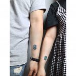 Matching birthstone tattoo by tattooist Nemo