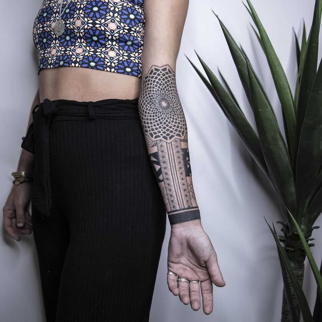 Ornamental forearm tattoo by Remy B