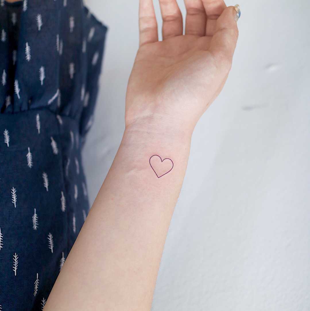 Outline heart by tattooist Nemo