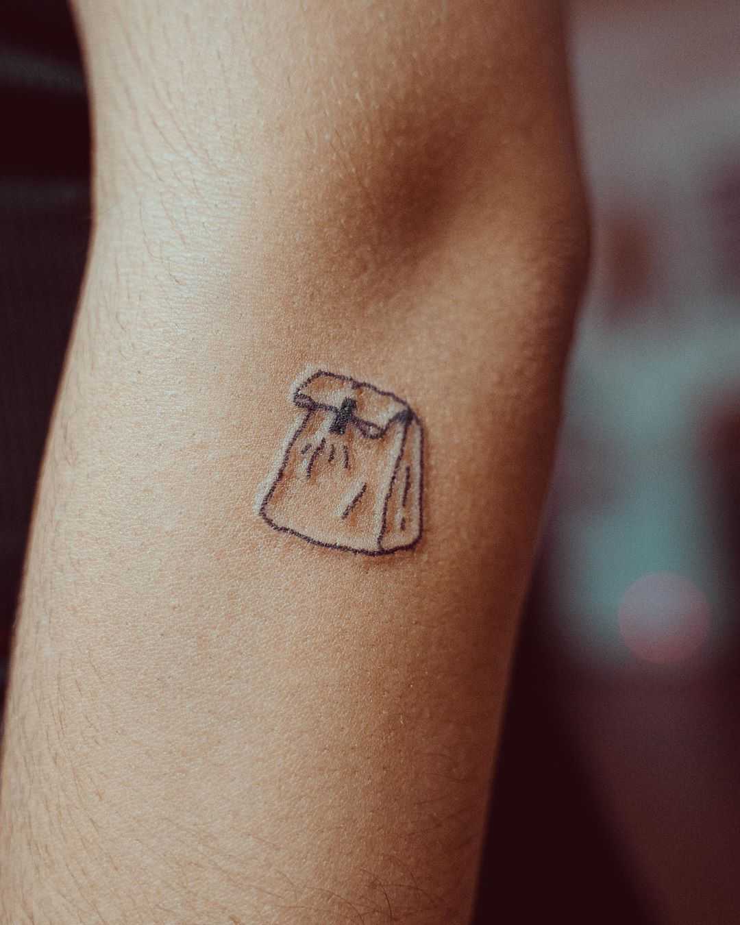 Paper bag tattoo by tattooist Bongkee