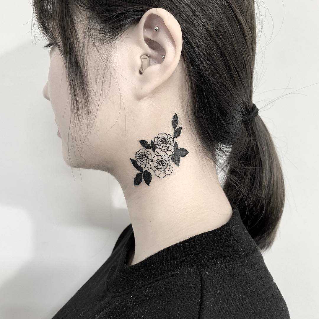 Rose on a neck by Nudy tattooer