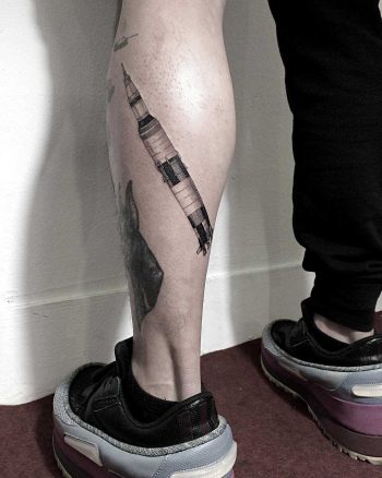 Saturn V tattoo by tattooist Oozy