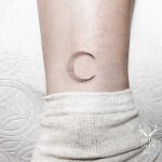 Small crescent moon tattoo by tattooist Goyo